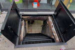 Main St, Flushing Queens — sidewalk door installation NYC