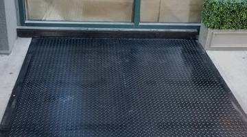 Large diamond plate install — sidewalk door installation NYC